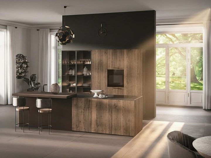 Wooden kitchen with porcelain stoneware top, integrated sink and windows onto the green