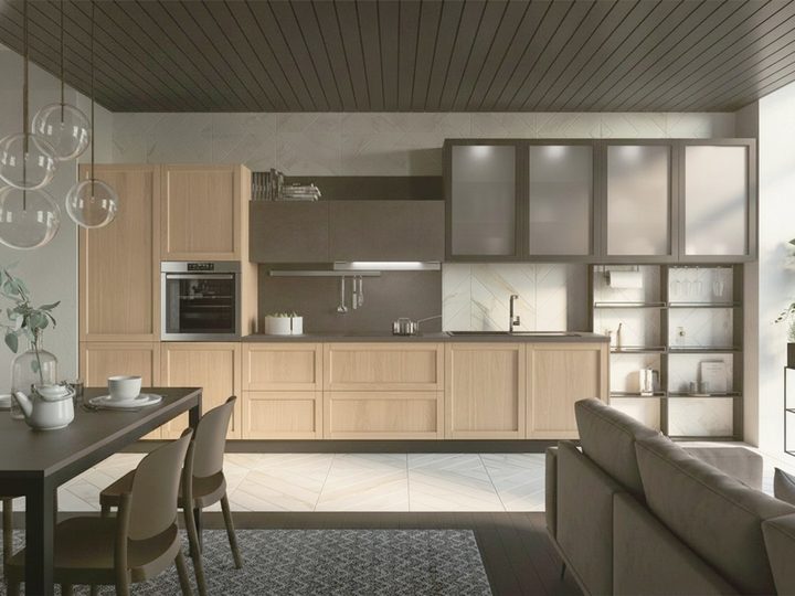 Indoor kitchen in pale wood with dark glass cabinets, dining table and black slatted ceiling