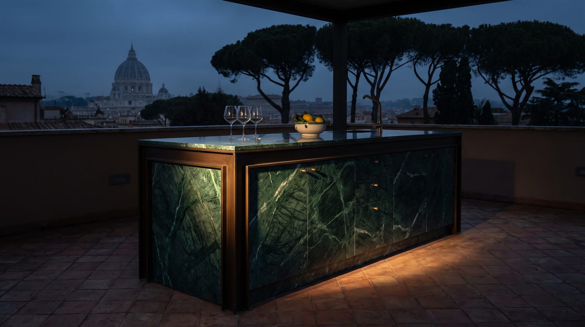 Visione Michelessi: isola in marmo Verde Guatemala con cornice in bronzo brunito su terrazza romana in cotto, con la cupola di San Pietro all'orizzonte