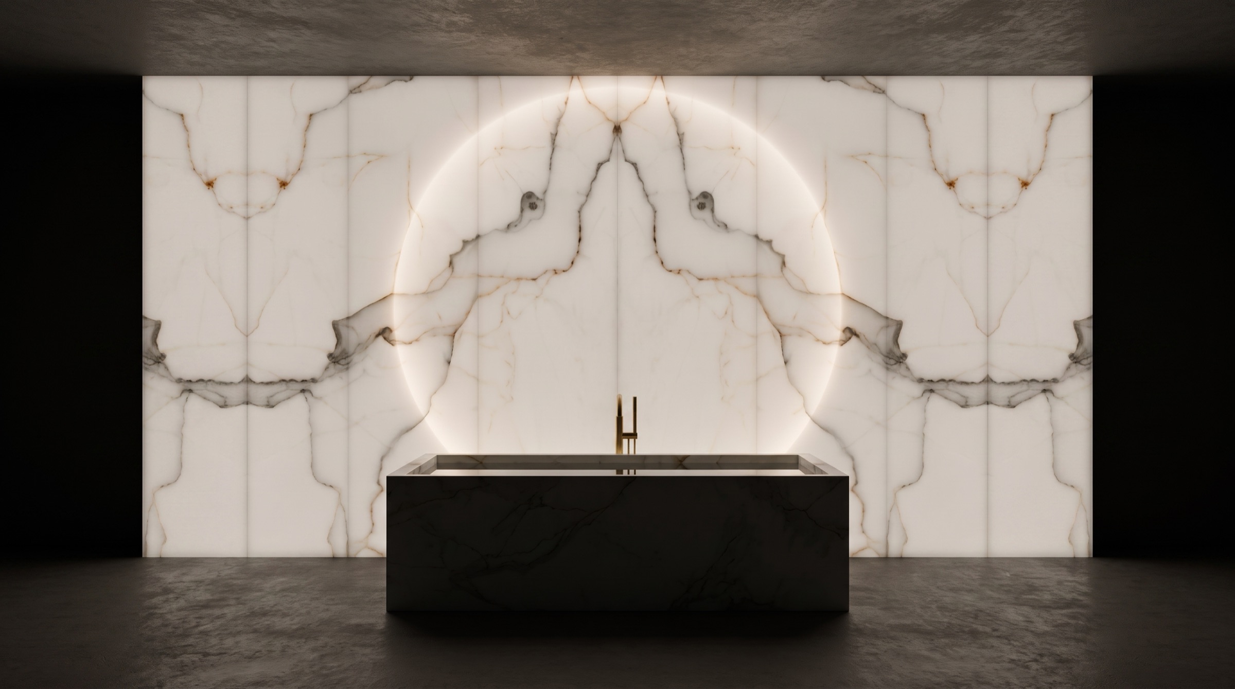 Bagno padronale nel buio con parete di onice bianco retroilluminata e vasca scavata in un blocco unico, una visione Michelessi