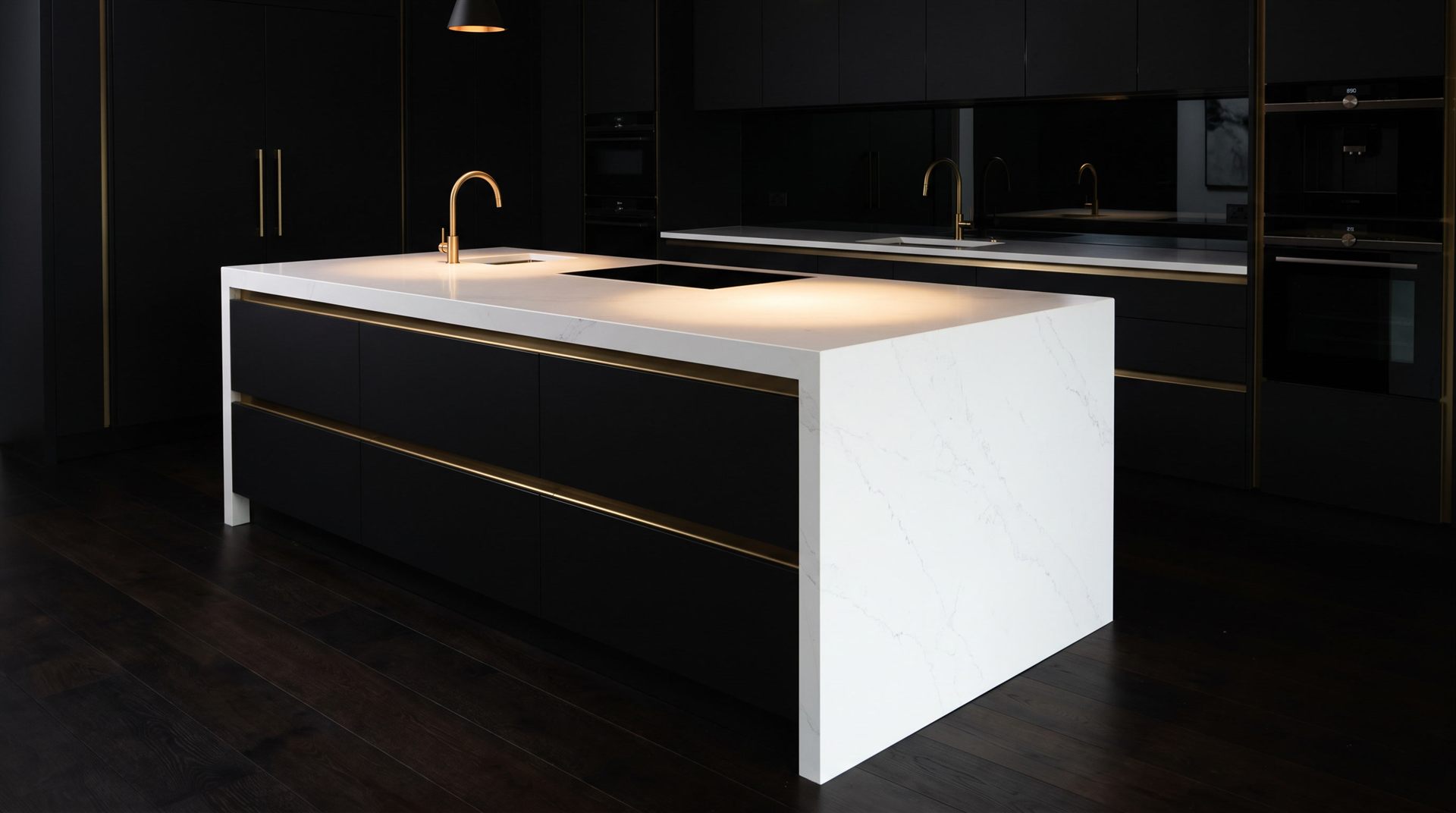 Design vision: absolute white quartz resin worktop cascading over a matt black island with brass profiles, in a dark theatrical setting